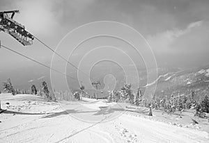 Skiers on chairlift - Black and White