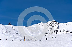 Skiers and chairlift in Solden, Austria