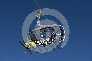 Skiers in chairlift St. Johann in Tirol Austria