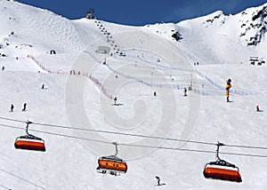 Skiers and chairlifts in Solden, Austria
