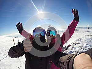 Skiers couple happy together in mountain