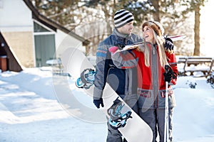 Skiers couple in love going to ski terrain