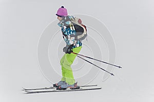 Skiers with Eiger north face behind, In winter. Kleine Scheidegg, Bernese Oberland, Switzerland photo