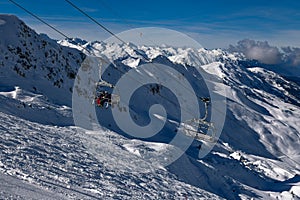 Skiers going up on the chairlift at the Meribel ski resort in France.