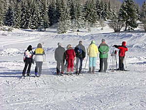 Skiers and instructor