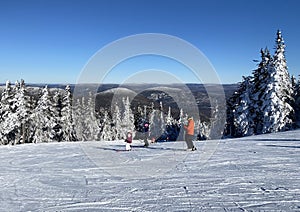 Skiers in Mont Tremblant summit, Quebec