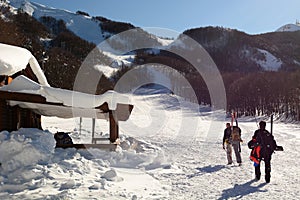 Skiers at Prato della Cipolla mountain cabin. Rocca d`Aveto, Santo Stefano d`Aveto. Liguria. Italy