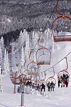 Skiers riding the ski-lift