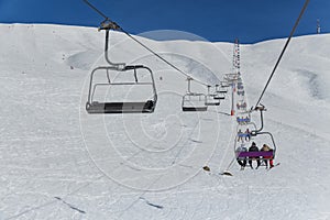 Skiers on a ski lift