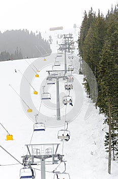 Skiers on a ski-lift in the famous holiday resort in Bansko, Bugarija