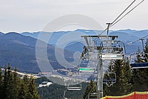 skiers on a ski lift going to the slope for a ride. Active recreation with the family.