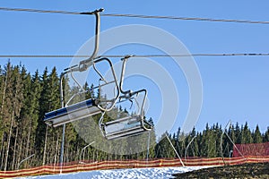 skiers on a ski lift going to the slope for a ride. Active recreation with the family.