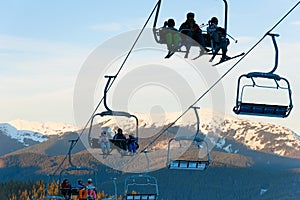Skiers ski lift mountains resort
