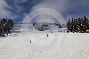 Skiers on ski slope, people skiing