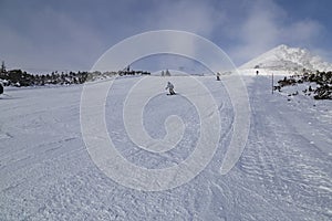 Skiers on ski slope, people skiing