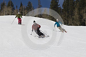 Skiers Skiing Down Slope