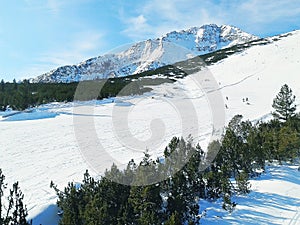 Skiers on the slope in Bansko, Bulgaria