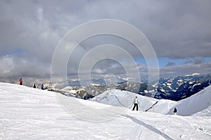 Skiers on the slope in Saalbach, Austria photo