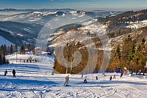 Skiers on slope of Velka Raca - Oscadnica ski resort