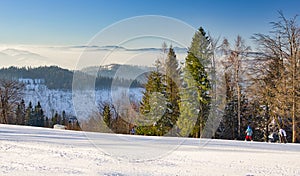 Skiers on the slope of Velka Raca - Oscadnica ski resort