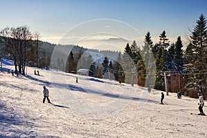 Skiers on the slope of Velka Raca - Oscadnica ski resort