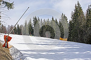 skiers on a snow slope for beginners on a sunny day.