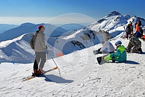 Skiers and snowboarders before descend on the ski track