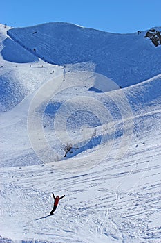 Skiers and snowboarders riding on a ski slope