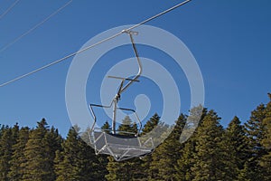 Skiers and snowboarders on a ski lift