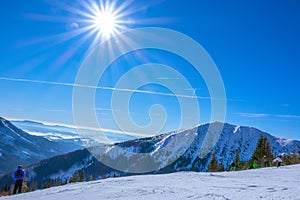 Skiers on a Sunny Ski Slope