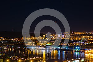 In the skies over night city Vladivostok hanging unidentified flying object