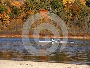 Skiff on autumn lake photo