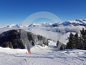Skiing in the Alps skislope sunny day