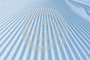 Skiing background - fresh snow on ski slope