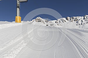 Skiing background - fresh snow on ski slope