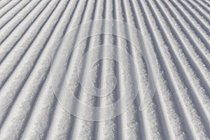 Skiing background - fresh snow on ski slope