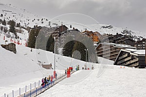 Skiing belt lift or moving carpet in Meribel ski area lifting pe