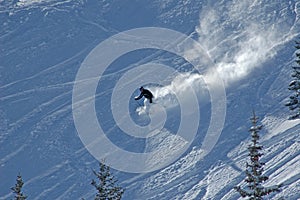 Skiing down in the powder