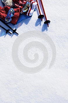 Skiing equipment snow background, ski vacation concept, white copy space, vertical