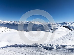 Skiing in French alps with a lot of sun