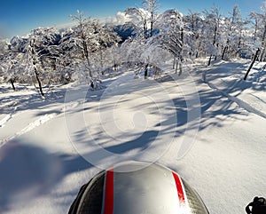 Skiing in fresh snow. POV using action cam on the helmet