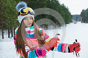 A skiing girl in bright sport clothes