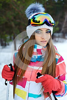 A skiing girl in bright sport clothes