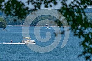 Skiing on the lake with a pontoon boat