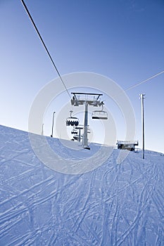 Skiing lift, snow and tracks