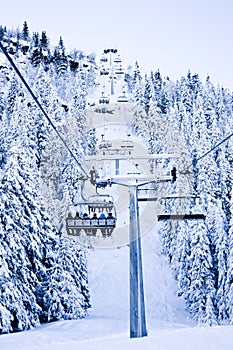 Skiing lift up mountain