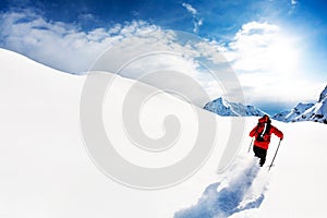 Skiing: male skier in powder snow