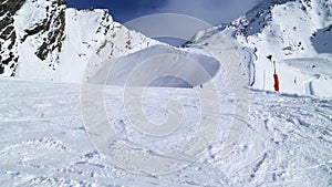Skiing on mogul slope in alpine resort Les Arcs photo