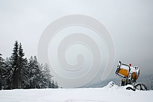 Skiing place with snowmaking machine