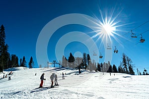 Skiing and snowboarding in the mountain area of Krasnaya Polyana ski resort, Sochi, Russia